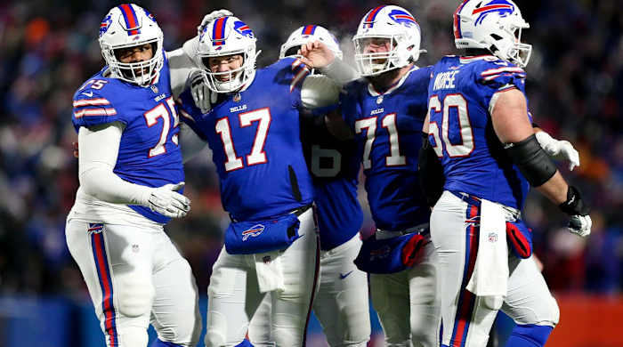 Buffalo Bills quarterback Josh Allen (17) celebrates after wide receiver Gabriel Davis (13) scores a touchdown during the second half of an NFL wild-card playoff football game against the New England Patriots, Saturday, Jan. 15, 2022, in Orchard Park, N.Y.